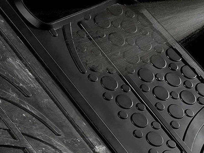 Black rubber mat being cleaned